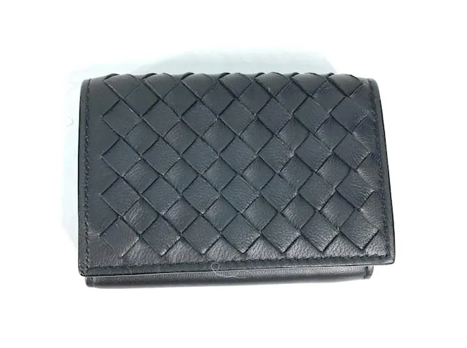 Cartera de cuero negro Bottega Veneta con tres pliegues 