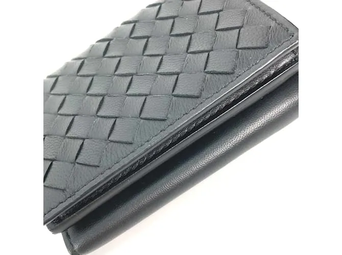 Cartera de cuero negro Bottega Veneta con tres pliegues 