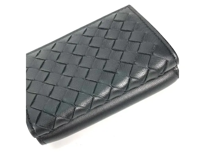 Cartera de cuero negro Bottega Veneta con tres pliegues 