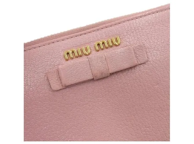 Miu Miu Cartera de cuero con cremallera alrededor y lazo en muy buen estado Rosa 